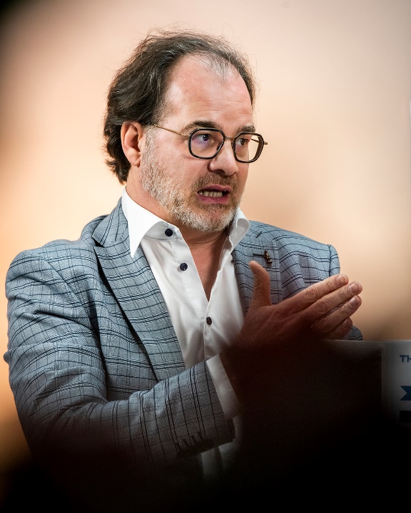Hans Van Heghe speaking at an event